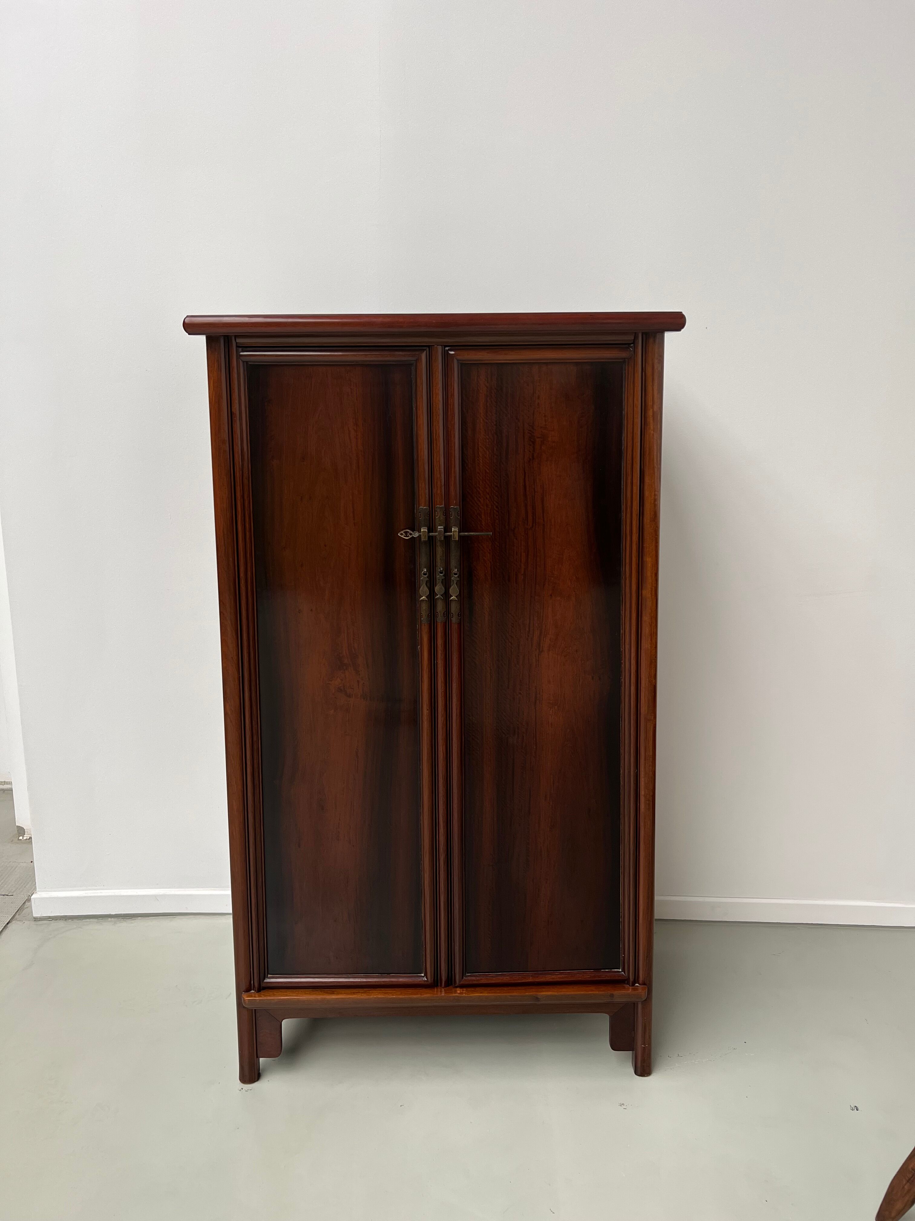 Chinese trapezoidal roller cabinet, made of rosewood.