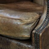 Warm, cosy and comfortable vintage sheepskin ear armchair with character