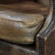 Warm, cosy and comfortable vintage sheepskin ear armchair with character