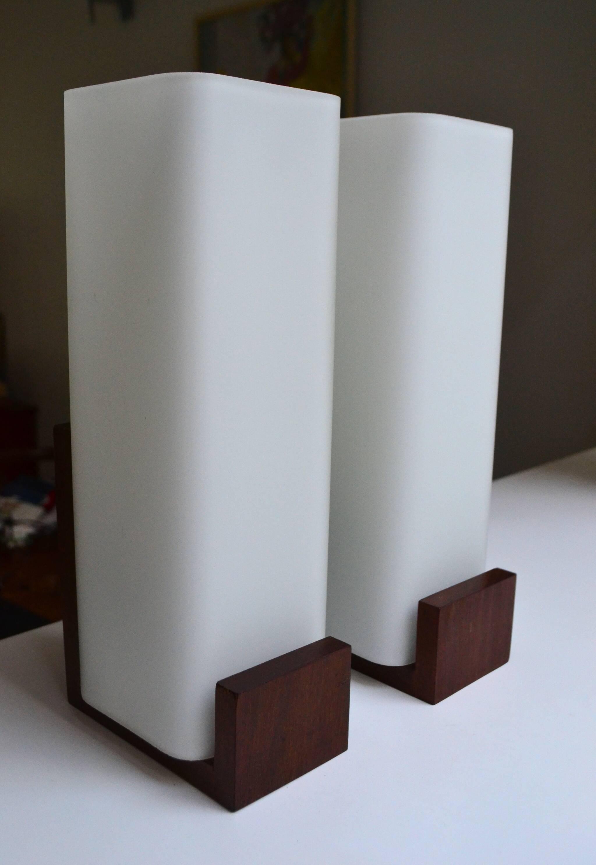 Pair of Louis Kalff wall lights, teak opalines from the 50s/60s.