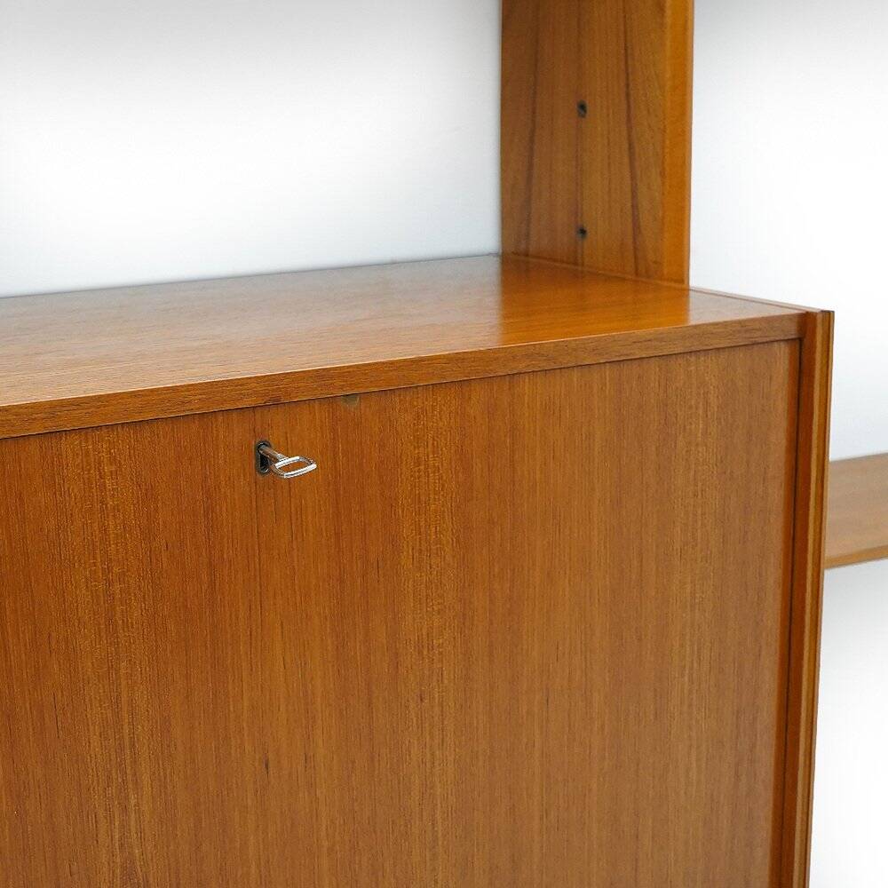 Library with wooden uprights by A.V. Contemporary Furnishings, 1960s.