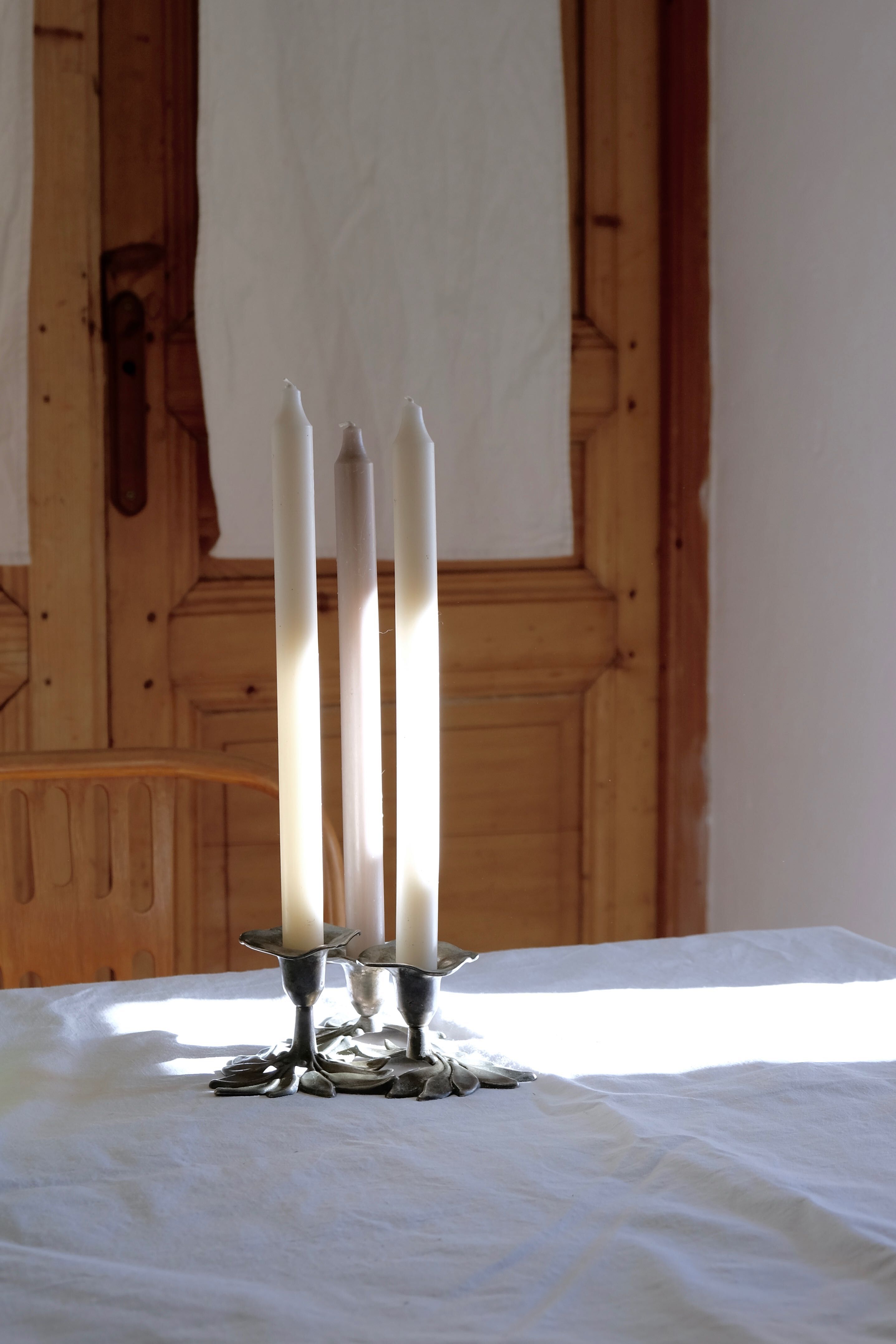 Three-flower pedestal 19th century candlestick