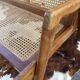 Cane-seated teak bench