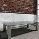 Vintage coffee table with smoked glass and chrome.