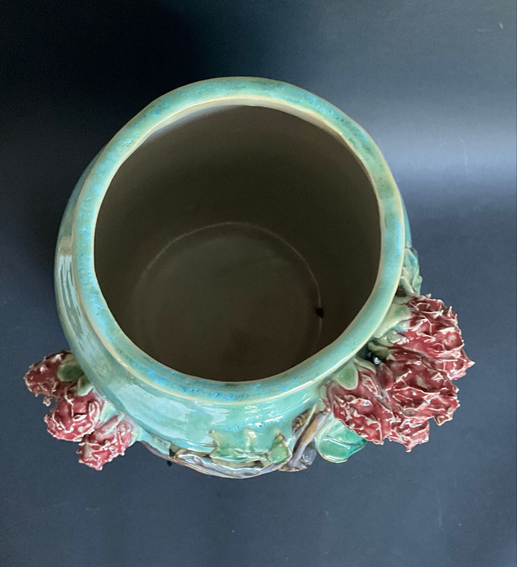 Large turquoise ceramic vase Athezza with raised floral decoration.