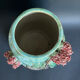 Large turquoise ceramic vase Athezza with raised floral decoration.