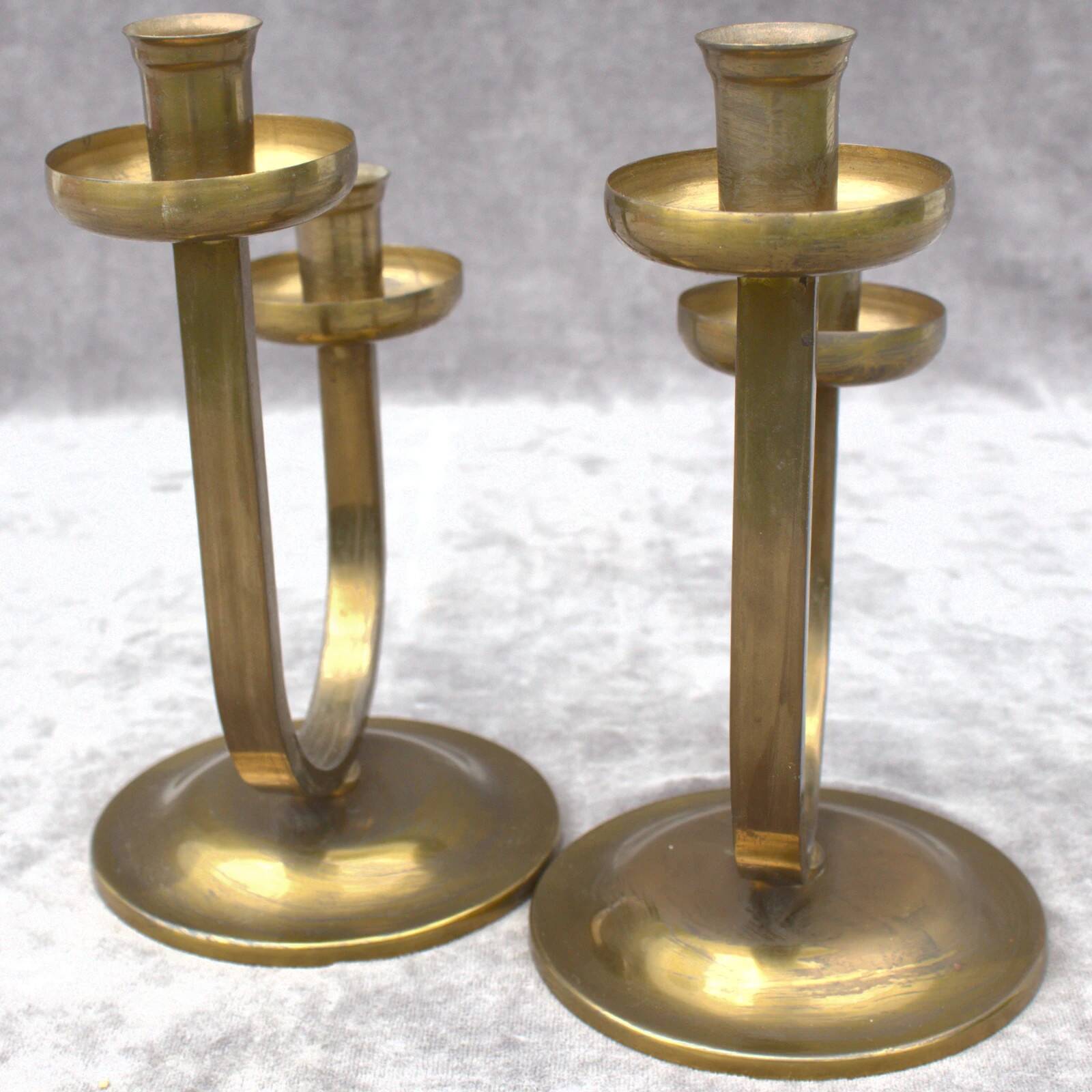 A beautiful pair of antique French Art Deco brass candlesticks