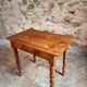 Small antique French writing table in walnut with a drawer, around 1900.