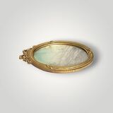 Antique oval wall mirror in gilded resin – Louis XVI knot –