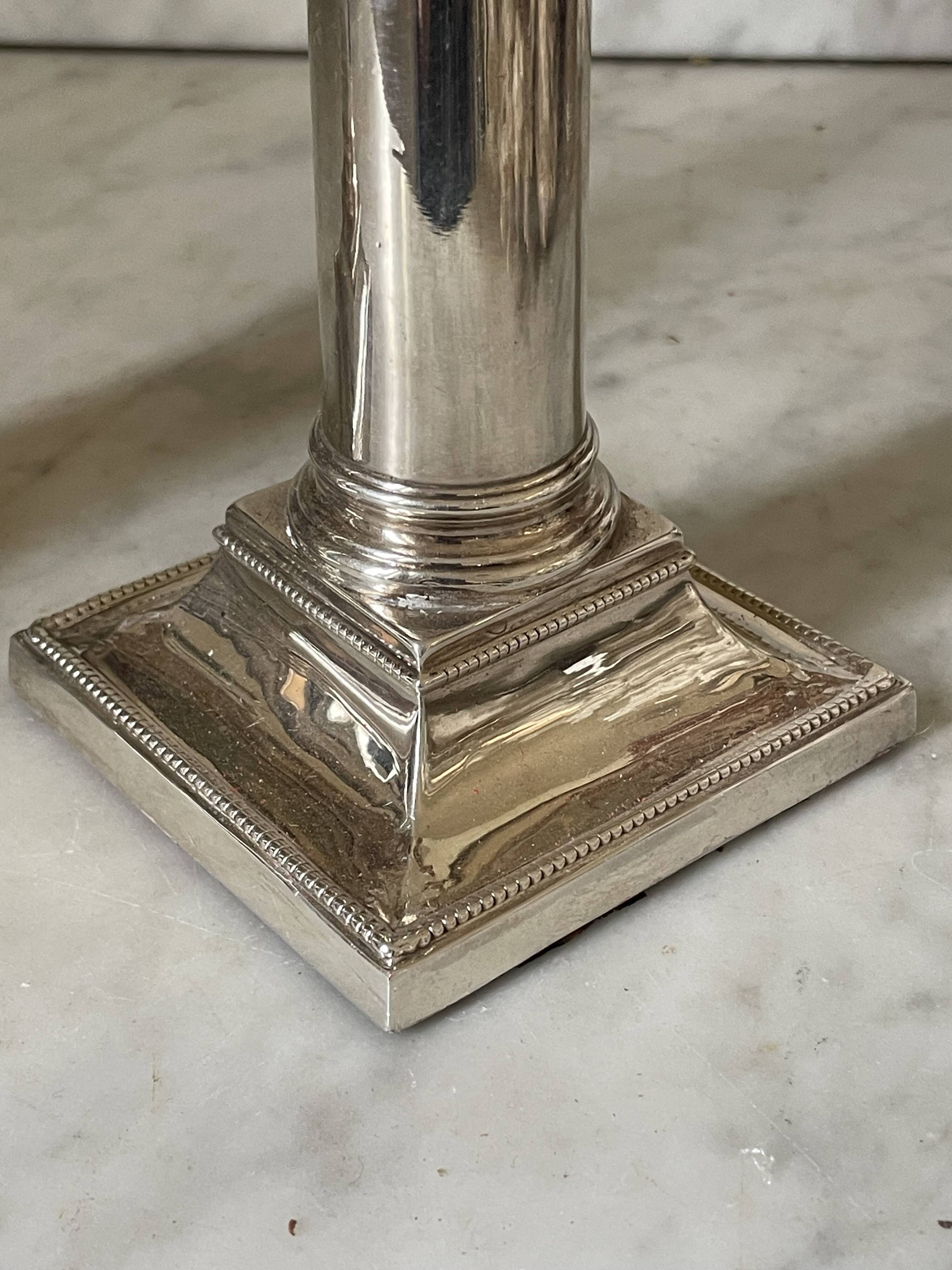 pair of Victorian style silver-plated candlesticks