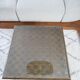 Square table in woven chestnut, with glass top
