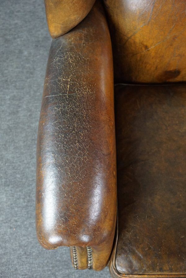 Patinated sheepskin armchair