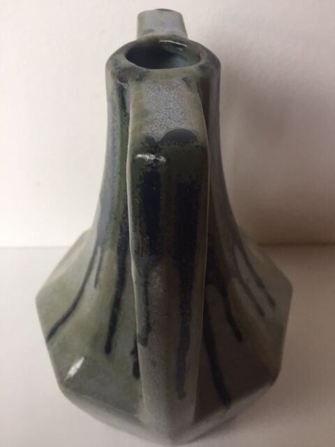 Ancient amphora vase in sand