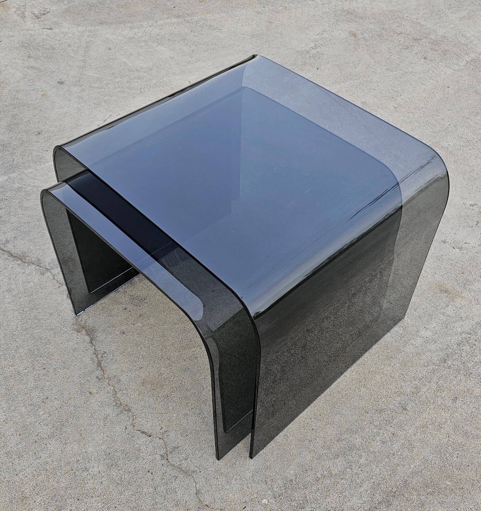 Pair of Waterfall nesting tables in tinted glass attributed to FIAM 1980s.