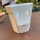 Wall-mounted cache-pot in white porcelain