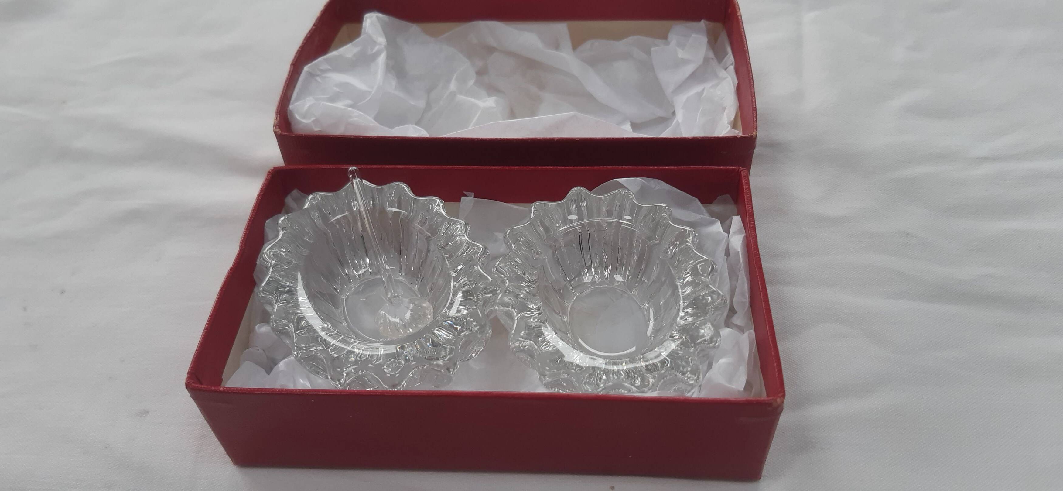 Antique crystal salt and pepper shakers, with their small spoon