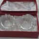 Antique crystal salt and pepper shakers, with their small spoon