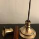 Pair of brass and mahogany wood candle holders
