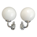 Pair of chrome wall sconces for bathroom with vintage fish pattern.