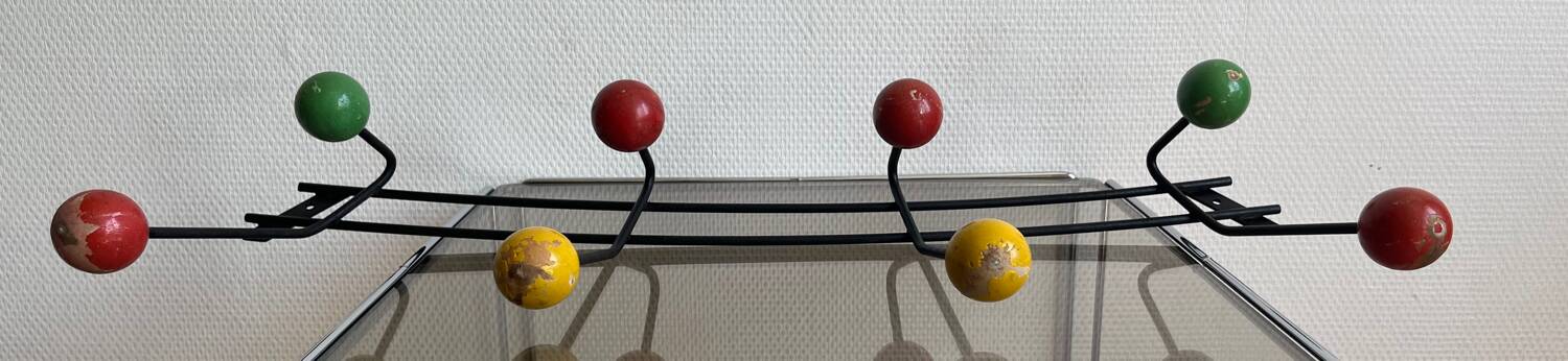 Iron wall coat rack and wooden hooks from the 60s