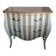 Curved commode with beige and white stripes.