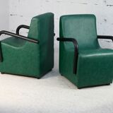 Pair of armrest heaters. Steel and green imitation leather. France, circa 1980