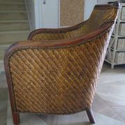 Woven rattan armchair and exotic wood in colonial style, 1980s.