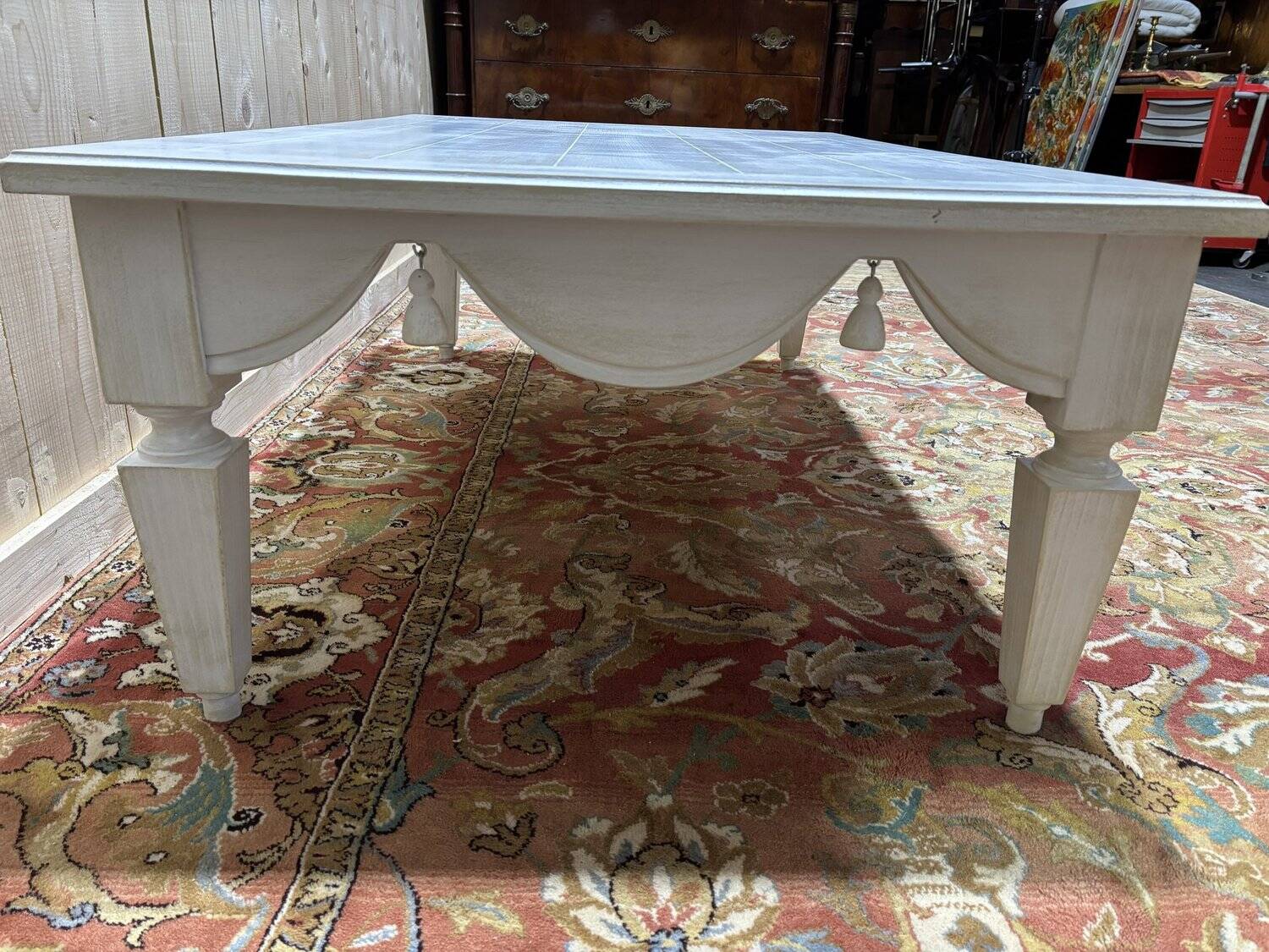 Painted wood coffee table with a distressed finish.