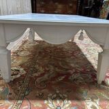 Painted wood coffee table with a distressed finish.