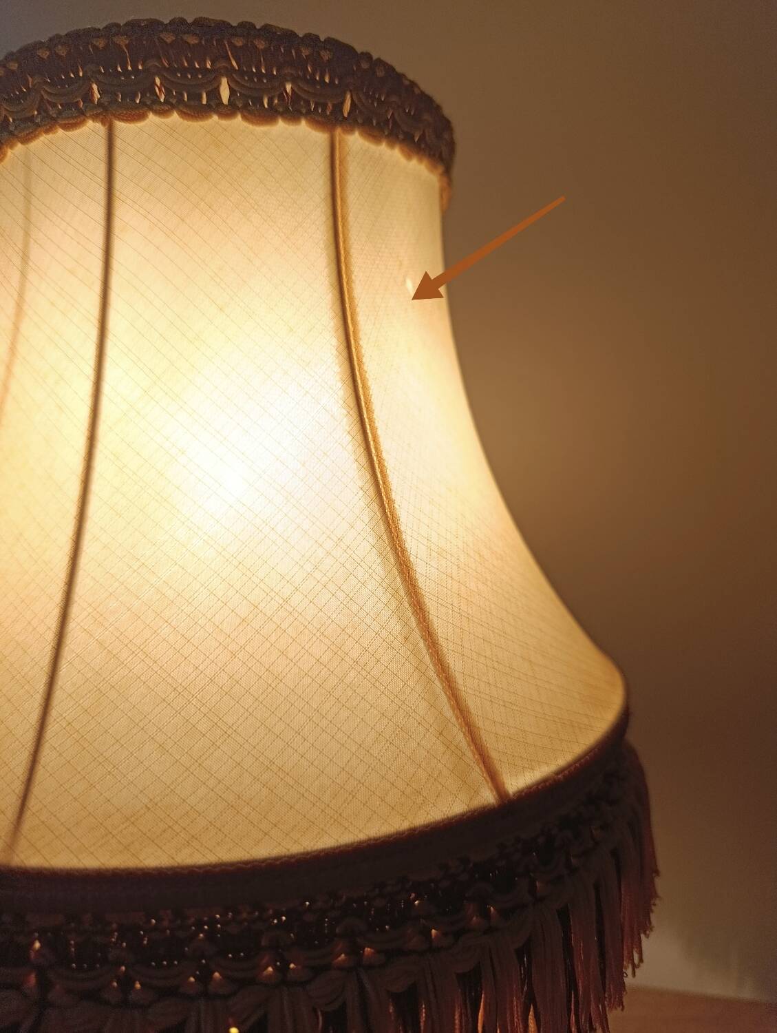 Chic retro lamp with a bronze pagoda fringe shade, 1950.