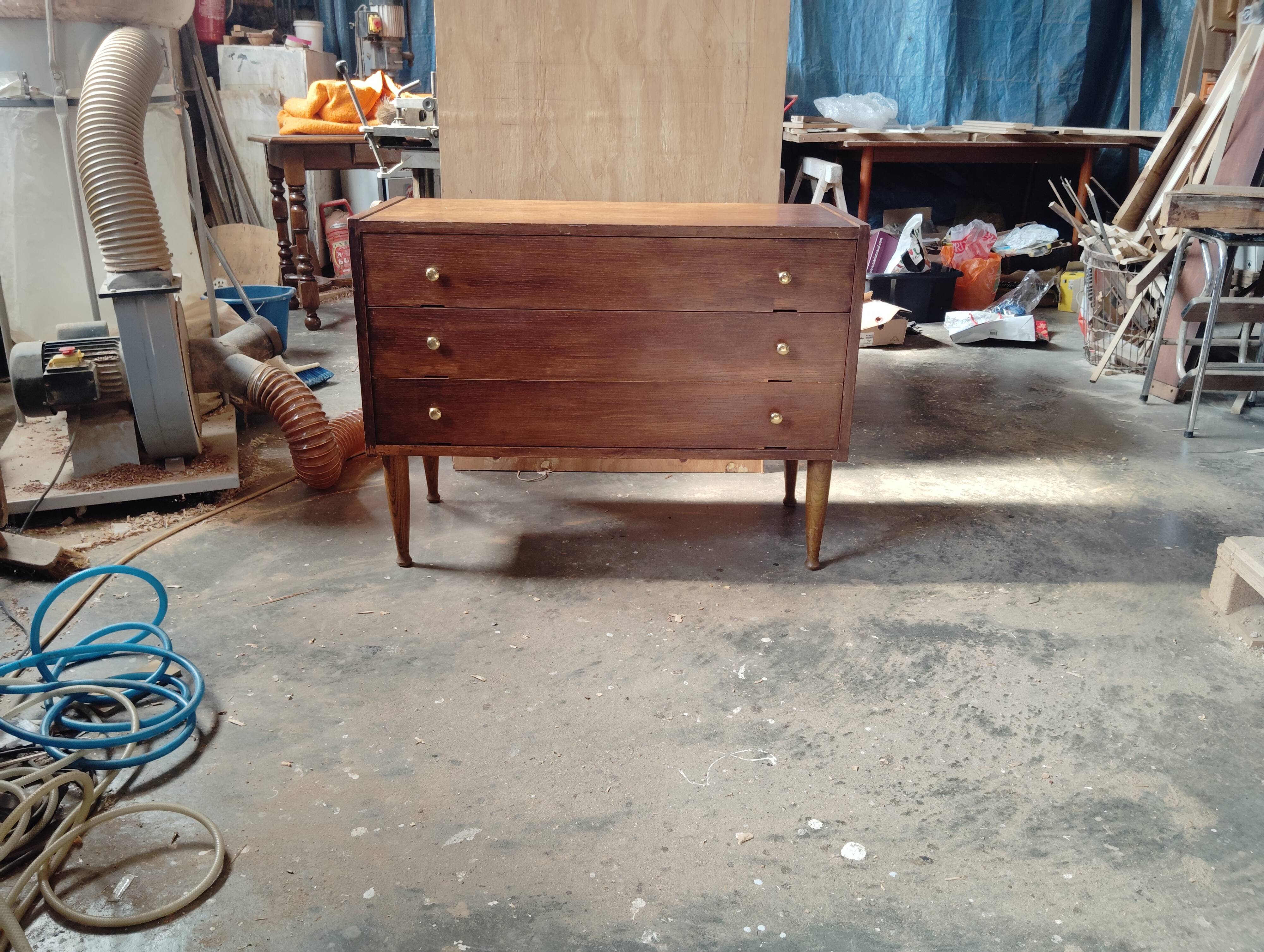 Vintage commode with tapered legs.