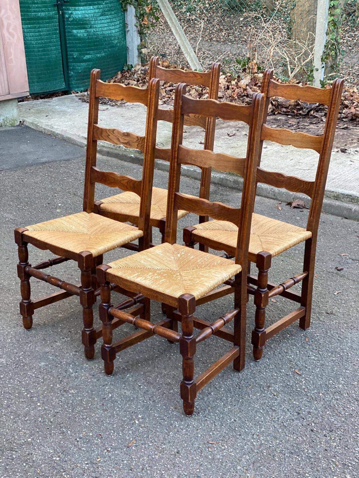 4 solid wood chairs with straw seats and high backs, 108cm.