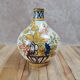 Antique hand-decorated faience vase – floral and bird design