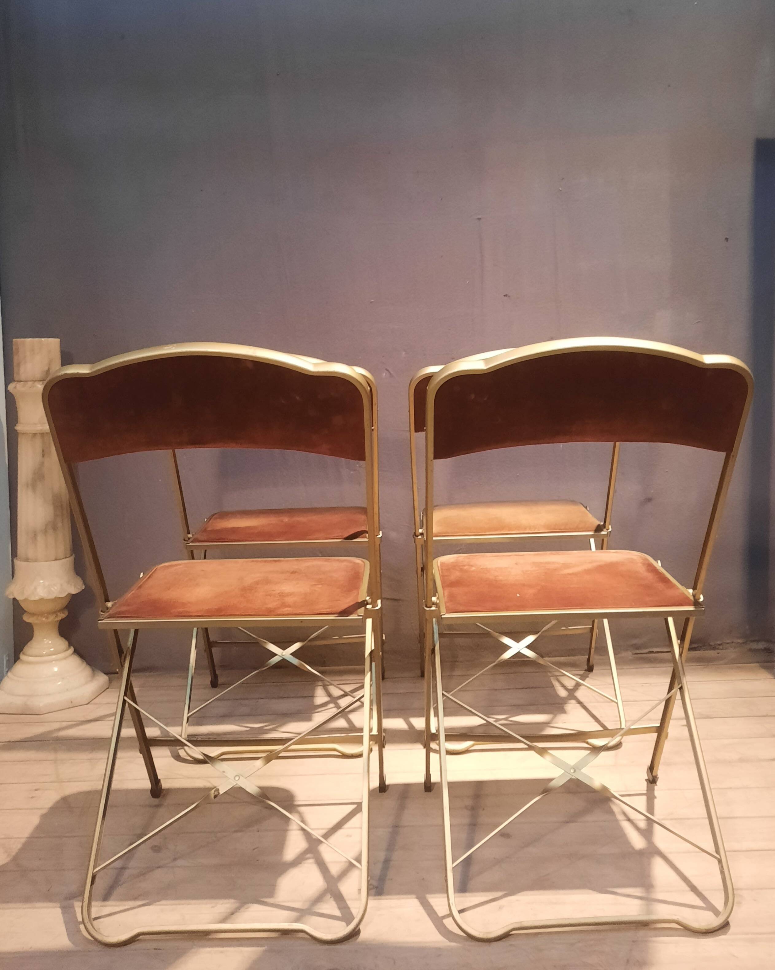 Set of four folding metal and velvet chairs