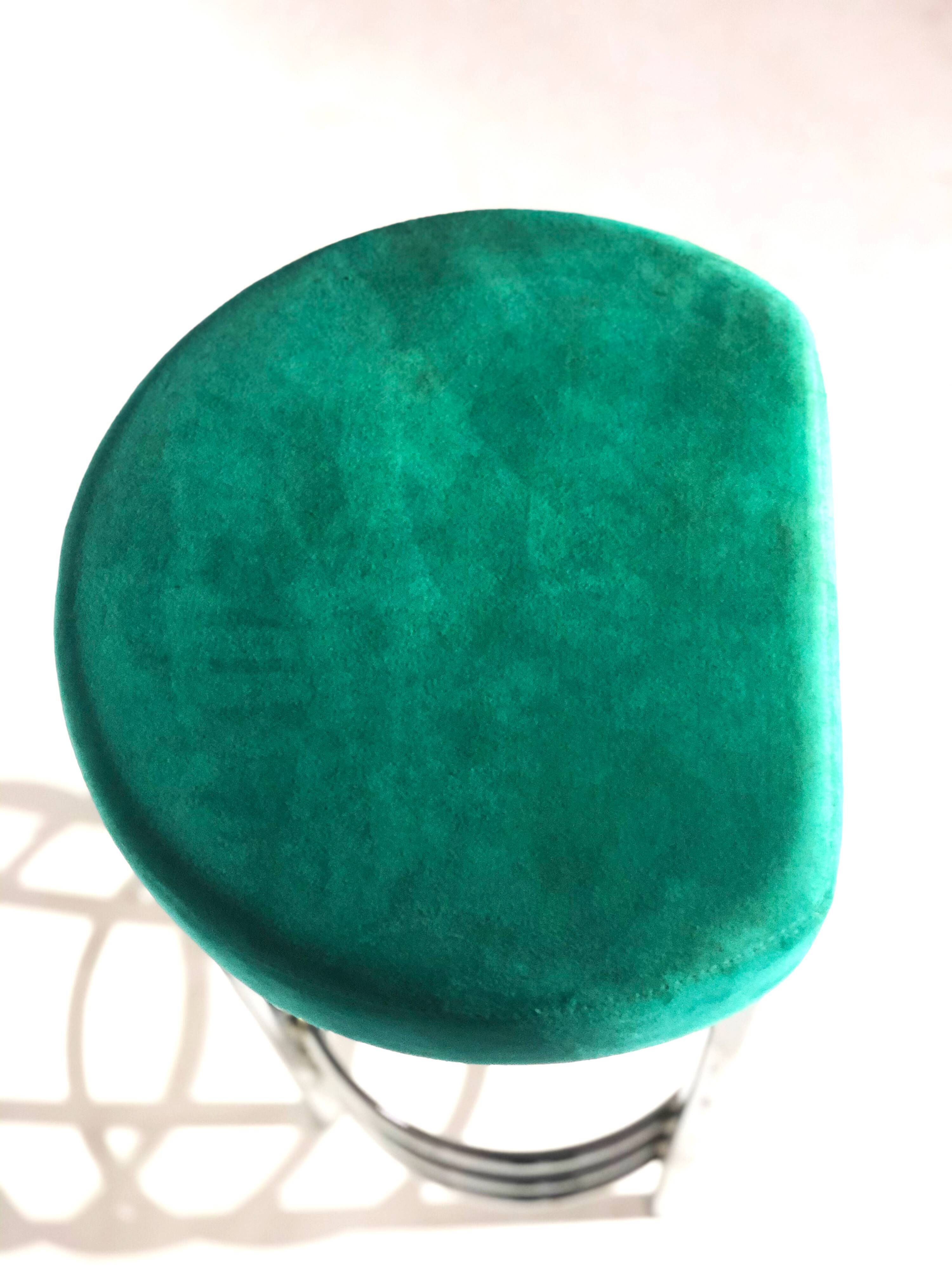 Contemporary aluminum stool and green/blue velvet