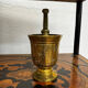 Golden brass mortar and pestle