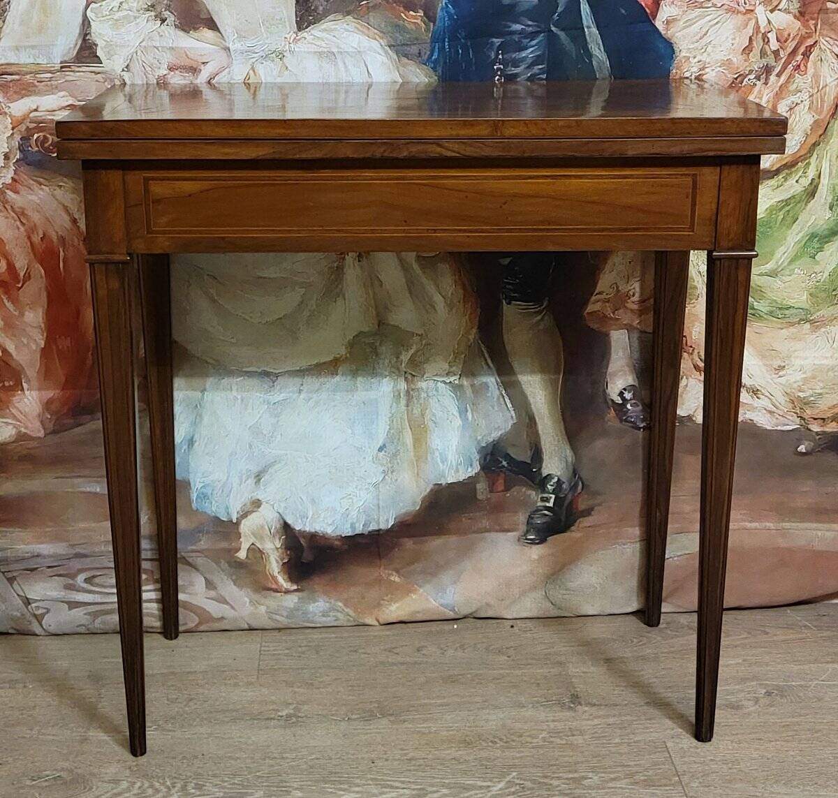 Louis XVI period game table in mahogany and marquetry.