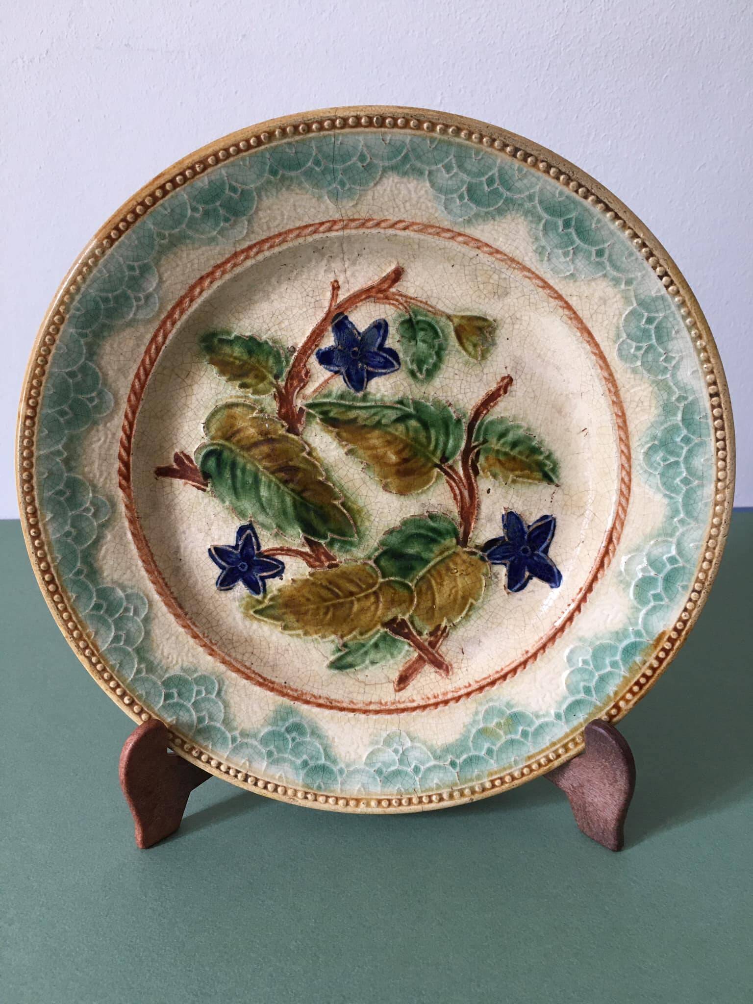 Old barbotine dessert plate. Floral patterns