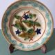 Old barbotine dessert plate. Floral patterns