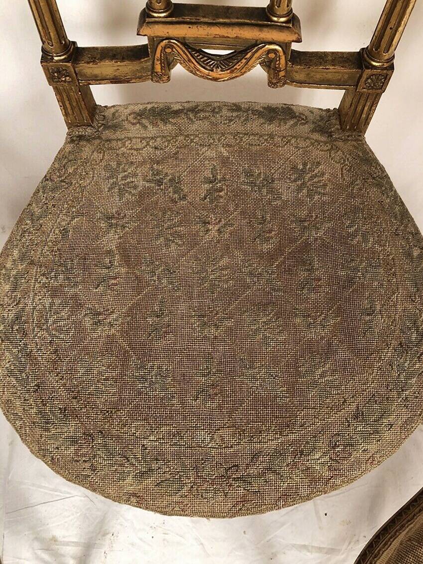 Series of three Louis XVI style chairs in gilded wood, circa 1900