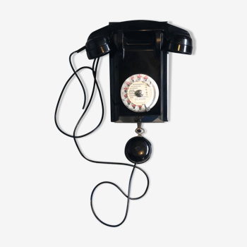 Vintage bakelite rotary wall mounted telephone