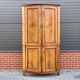 Louis Seize Oak corner cabinet with a quarter curved front