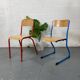Set of 2 mismatched industrial school chairs