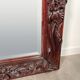 Large mirror (2 metres) Art Nouveau in carved mahogany with high-relief decoration.