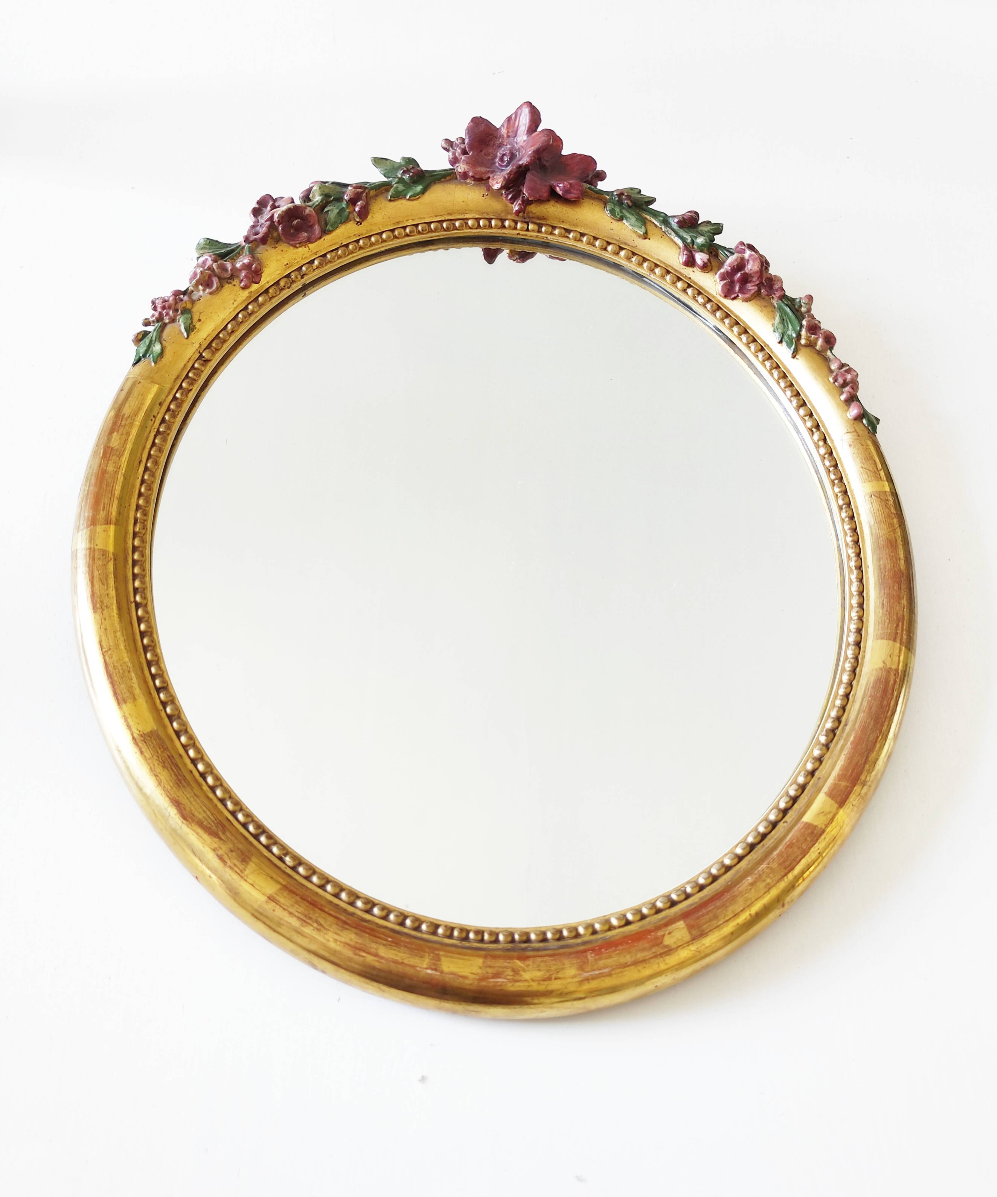 Miroir en bois doré avec fleurs