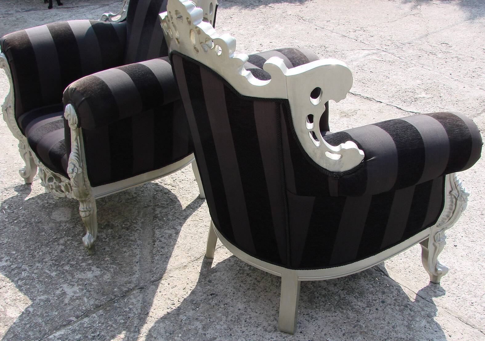 A pair of vintage armchairs, 1980s, lacquered wood and fabric