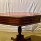 Vintage octagonal gueridon, 4 drawers, leather top, lion's paw feet.