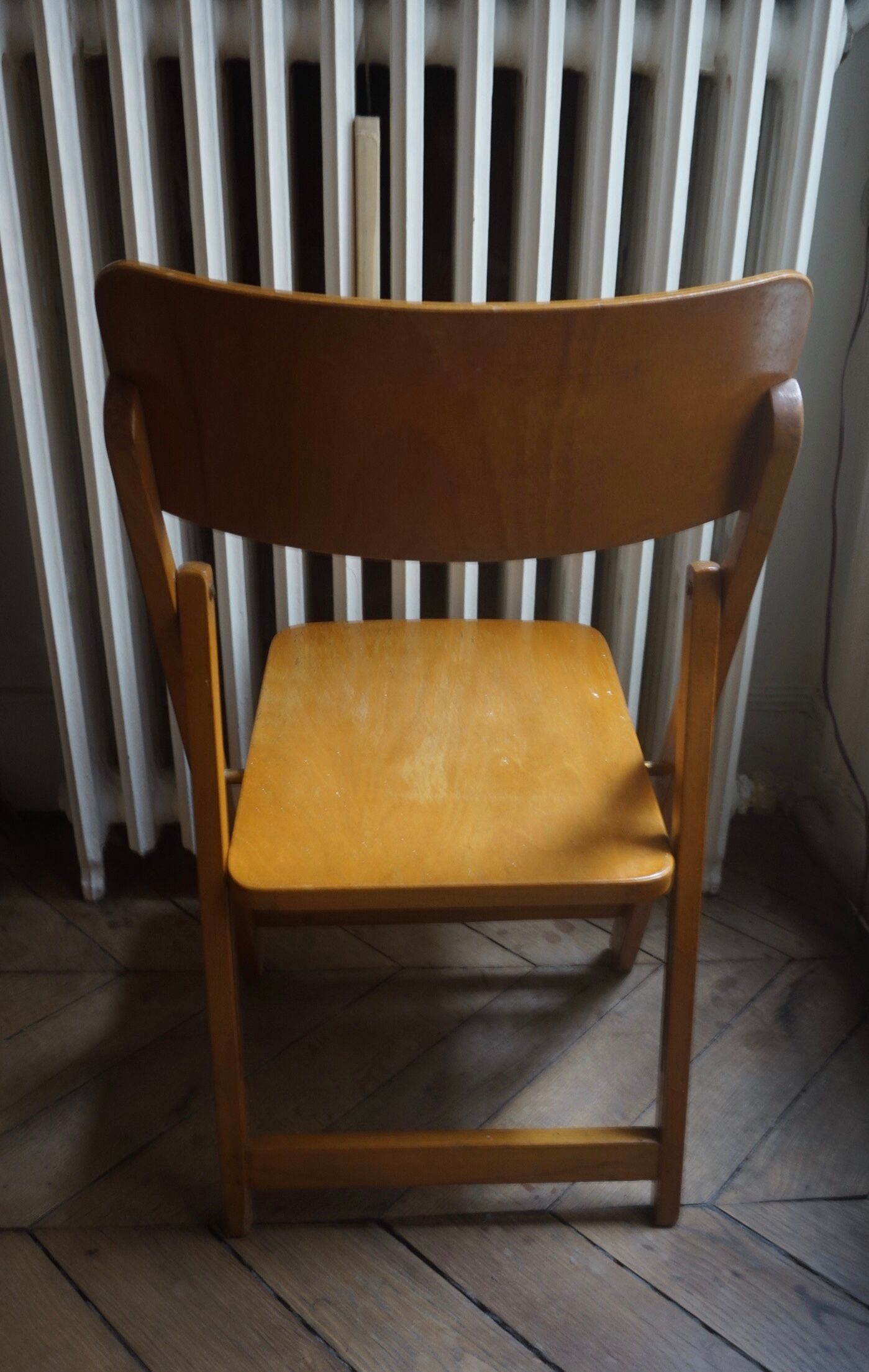 Vintage folding wooden heater chair