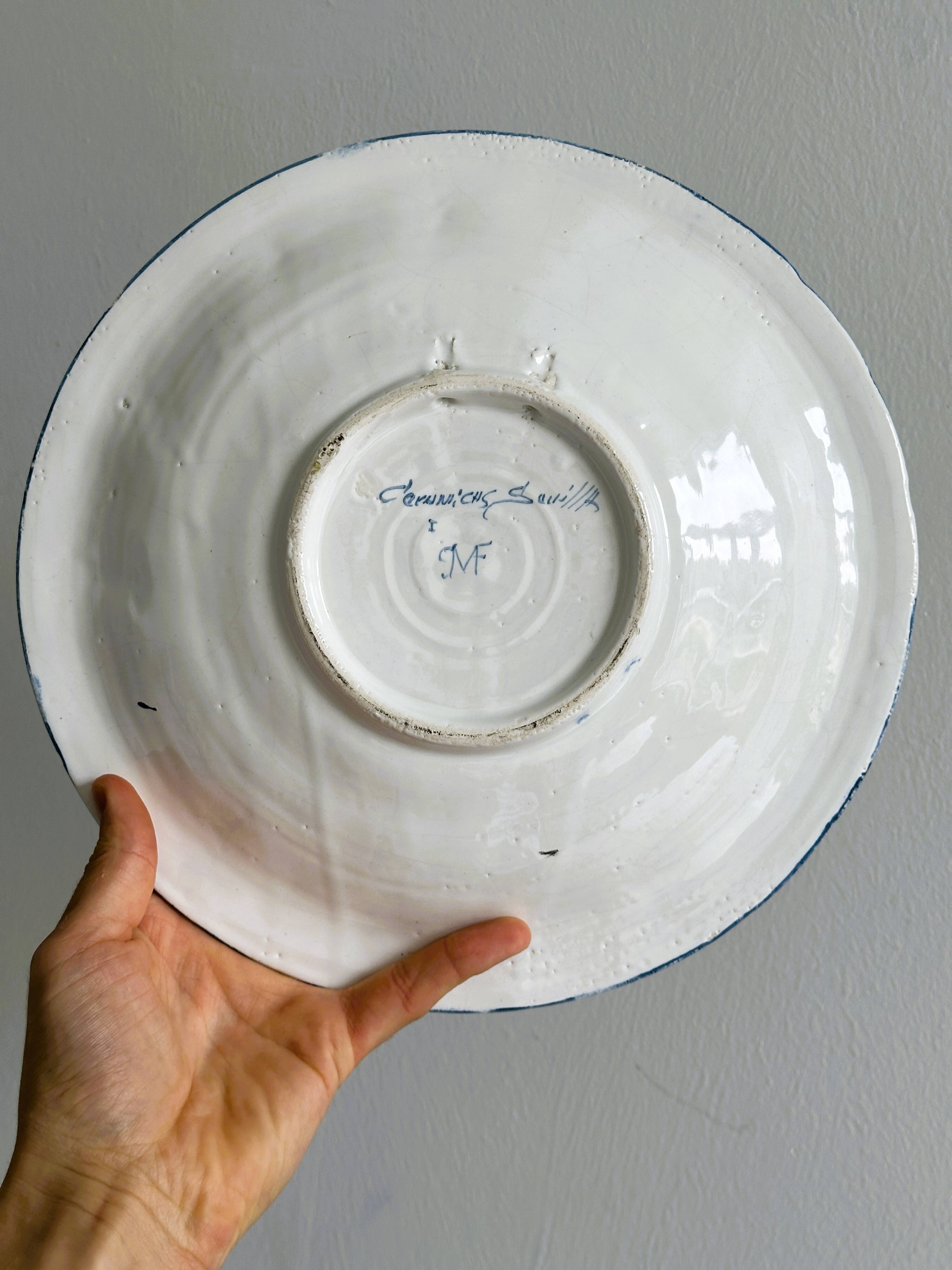 Hand painted decorative dish with floral motifs