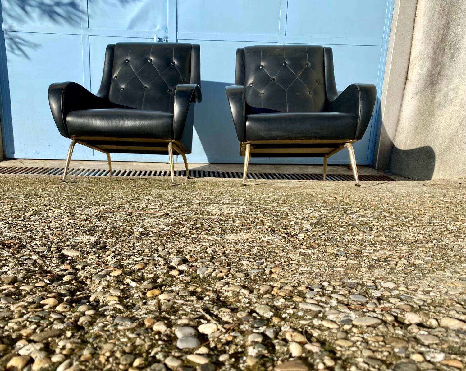 2 vintage faux leather armchairs